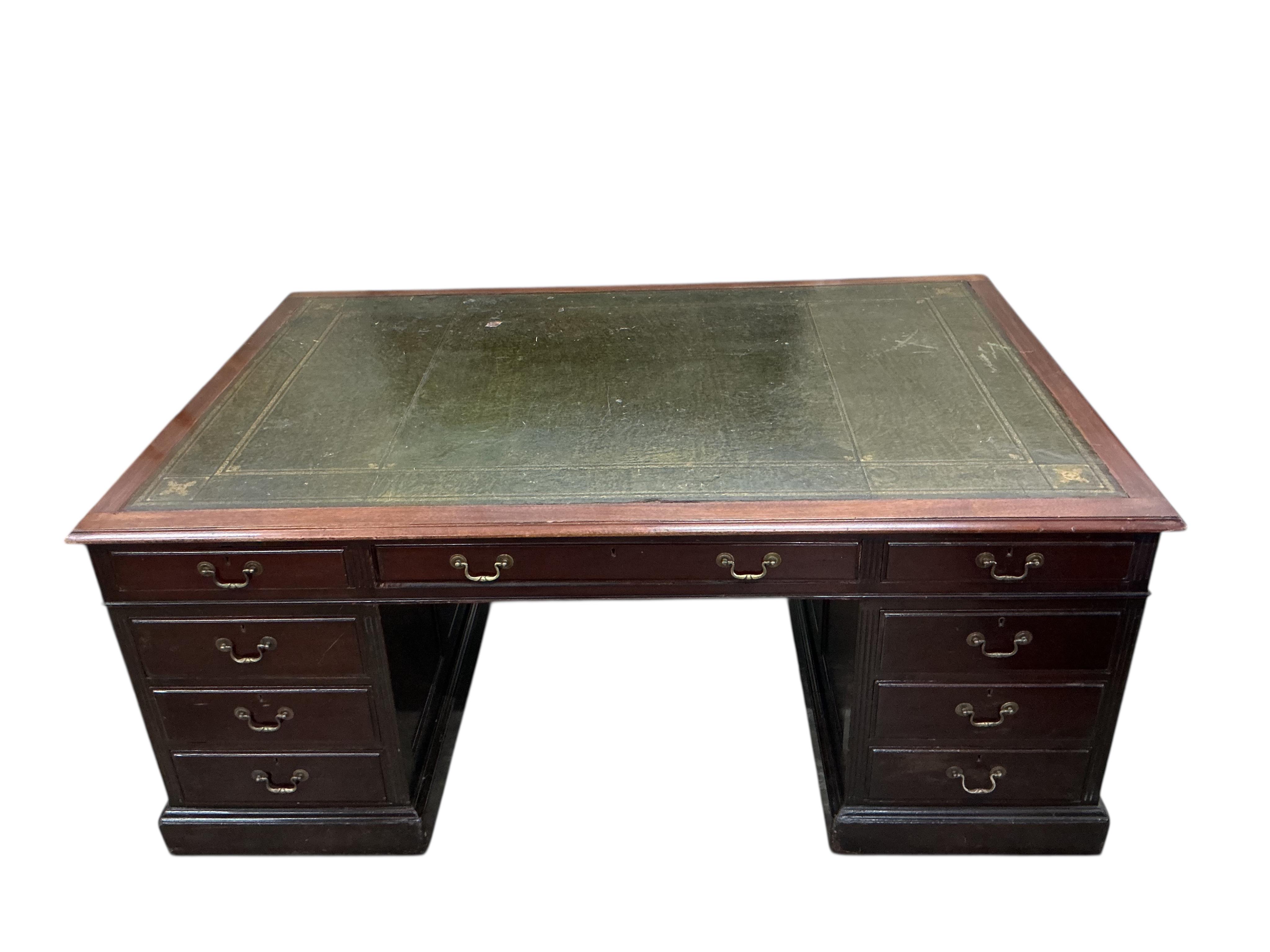 A reproduction George III style mahogany pedestal partners desk, width 180cm, depth 120cm, height 76cm, together with a button green leather swivel desk chair